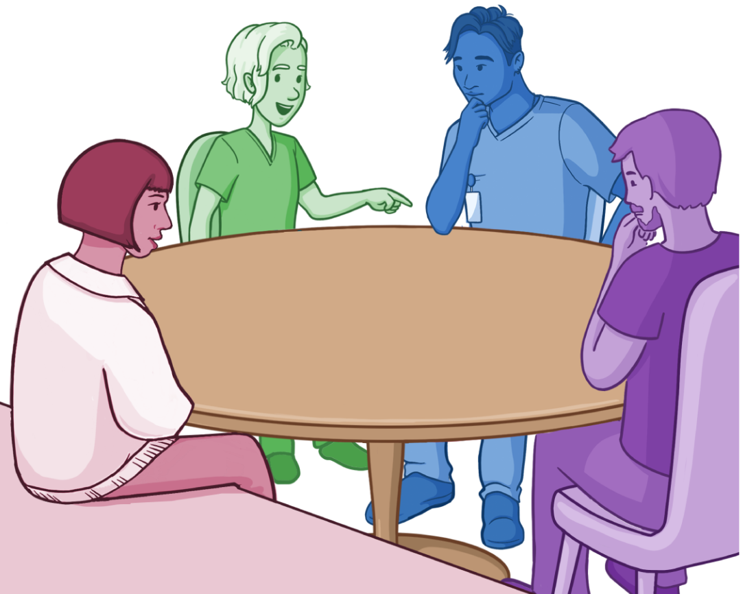 group of students talking around a table